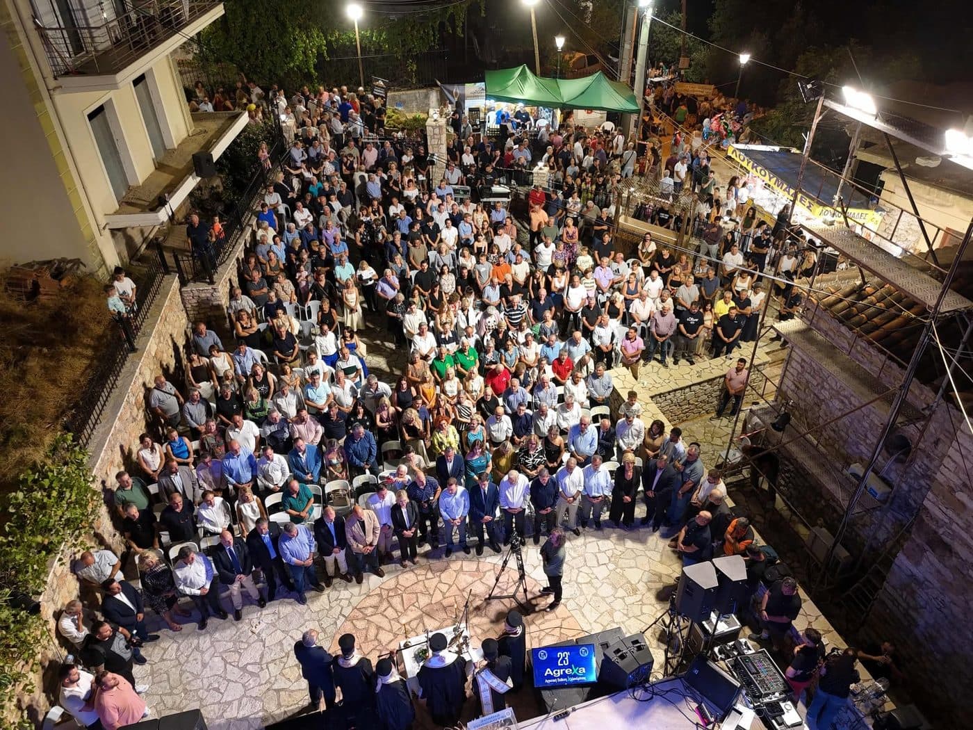 A crowd seen from above at the fair's evening opening ceremony